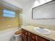 Bright bathroom features a tub/shower combination and single-sink vanity at 1444 Oak Haven Dr, Safety Harbor, FL 34695