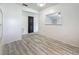 Open-concept dining area with neutral walls and wood-look flooring at 1444 Oak Haven Dr, Safety Harbor, FL 34695