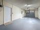 Attached garage with garage door and convenient access door at 1444 Oak Haven Dr, Safety Harbor, FL 34695