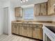 Kitchen with ample cabinet space and a stainless-steel sink with neutral countertops at 1444 Oak Haven Dr, Safety Harbor, FL 34695