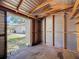Inside view of the metal exterior of a metal shed and a door to the yard at 1444 Oak Haven Dr, Safety Harbor, FL 34695