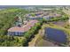 Aerial view of an apartment complex with ponds and trees, on a sunny day at 1610 Raena Dr # 204, Odessa, FL 33556