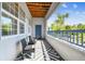Balcony with seating, a geometric rug, and a view of blue skies and lush greenery at 1610 Raena Dr # 204, Odessa, FL 33556