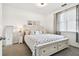 Inviting bedroom with a comfortable bed, neutral decor, window, and soft carpeting at 1610 Raena Dr # 204, Odessa, FL 33556