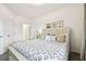 Serene bedroom with a cozy bed, light decor, a window, and soft carpeting at 1610 Raena Dr # 204, Odessa, FL 33556