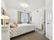 Bright bedroom featuring a window, carpet and ample lighting at 1610 Raena Dr # 204, Odessa, FL 33556