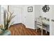 Cozy entryway area with stylish desk, decor, and wood floors at 1610 Raena Dr # 204, Odessa, FL 33556