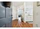 Inviting entryway with wood floors, fresh paint, and an archway leading into the living space at 1610 Raena Dr # 204, Odessa, FL 33556