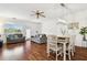 Open-concept living and dining area with laminate floors and a ceiling fan and views to exterior at 1610 Raena Dr # 204, Odessa, FL 33556