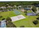 Community park featuring a basketball court, playground, and volleyball court at 1610 Raena Dr # 204, Odessa, FL 33556