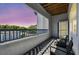 Outdoor patio with two chairs, a small table, and a view of parking at 1610 Raena Dr # 204, Odessa, FL 33556