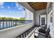 Outdoor patio with two chairs, a small table, and a view of trees at 1610 Raena Dr # 204, Odessa, FL 33556