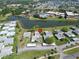 Aerial view of complex with lake and community pool at 201 Kings Blvd # 19, Sun City Center, FL 33573