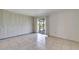 Spacious bedroom with ample closet space and sliding glass door to screened porch at 201 Kings Blvd # 19, Sun City Center, FL 33573