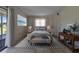 Relaxing bedroom featuring calm colors and decor and sliding door access to outdoor patio at 201 Kings Blvd # 19, Sun City Center, FL 33573