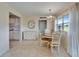 Dining room with chandelier and view of kitchen and exterior at 201 Kings Blvd # 19, Sun City Center, FL 33573