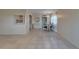 Open-concept dining room featuring tile floors, a chandelier, and natural light, ideal for gatherings at 201 Kings Blvd # 19, Sun City Center, FL 33573