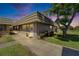 Inviting single-story home with manicured landscaping and a cozy front entrance, radiating curb appeal at 201 Kings Blvd # 19, Sun City Center, FL 33573