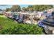 Line of parked golf carts, showcasing the preferred mode of transportation within the community at 201 Kings Blvd # 19, Sun City Center, FL 33573