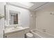 Bright full bathroom features a vanity, mirror, toilet, and tub at 2131 Ridge S Rd # 130, Largo, FL 33778