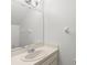 Bright bathroom featuring vanity with sink and mirror, freshly painted at 2131 Ridge S Rd # 130, Largo, FL 33778