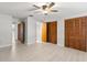 Spacious bedroom with natural light, two wooden closets, wood floors, and access to en-suite bath at 2131 Ridge S Rd # 130, Largo, FL 33778