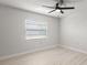 Bright bedroom features a ceiling fan, wood floors, and a window with blinds at 2131 Ridge S Rd # 130, Largo, FL 33778