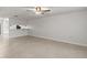 Bright living room with tile flooring and a ceiling fan creating a comfortable and stylish space at 2131 Ridge S Rd # 130, Largo, FL 33778