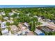 A peaceful neighborhood is highlighted with an aerial view of a lovely home surrounded by mature trees at 2920 N 11Th St, Tampa, FL 33605