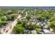 An aerial shot of this home in its lush, tree-filled neighborhood with a red pin drop on the property at 2920 N 11Th St, Tampa, FL 33605