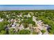 A picturesque aerial perspective captures a home nestled amidst lush greenery in a quiet neighborhood setting at 2920 N 11Th St, Tampa, FL 33605
