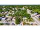 A bird's eye view highlights a charming home nestled among mature trees in a peaceful neighborhood at 2920 N 11Th St, Tampa, FL 33605