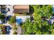 This aerial shot offers a birds-eye view of the property, nestled in a serene, tree-filled neighborhood at 2920 N 11Th St, Tampa, FL 33605