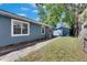 The home's exterior features a side yard and a small detached structure at 2920 N 11Th St, Tampa, FL 33605