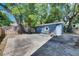 The backyard includes a large patio, mature trees, and an outbuilding at 2920 N 11Th St, Tampa, FL 33605