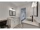 Chic bathroom with marble-topped vanities, vessel sinks, stylish tile flooring, and black fixtures at 2920 N 11Th St, Tampa, FL 33605