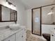 Modern bathroom showcasing a glass-enclosed shower with mosaic tile detail, and a vanity at 2920 N 11Th St, Tampa, FL 33605