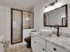 Modern bathroom showcasing a walk-in shower, vanity with sink, and striking tile work at 2920 N 11Th St, Tampa, FL 33605