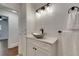 Bathroom featuring vanity with vessel sink, modern lighting, and decorative mirror at 2920 N 11Th St, Tampa, FL 33605