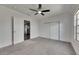Bedroom with closet doors, ceiling fan and a view to the kitchen at 2920 N 11Th St, Tampa, FL 33605