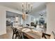 Well-lit dining room with seating for six, opening to the kitchen and living area at 2920 N 11Th St, Tampa, FL 33605