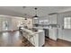 Open-concept kitchen with marble island, stainless appliances, and hardwood floors at 2920 N 11Th St, Tampa, FL 33605