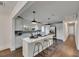 Bright kitchen features an island with bar seating, white cabinetry, and modern appliances at 2920 N 11Th St, Tampa, FL 33605