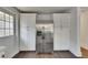 Eat-in kitchen with stainless refrigerator and large cabinets at 2920 N 11Th St, Tampa, FL 33605