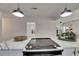Close-up of kitchen island with stainless cooktop and views to other rooms at 2920 N 11Th St, Tampa, FL 33605