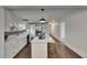 Updated kitchen boasts stainless appliances, farm sink, subway tile backsplash, and marble counters at 2920 N 11Th St, Tampa, FL 33605