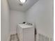 Laundry room featuring a washer and dryer with patterned tile floors at 2920 N 11Th St, Tampa, FL 33605