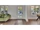 Bright, airy living room featuring hardwood floors, and multiple windows at 2920 N 11Th St, Tampa, FL 33605