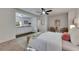 Main bedroom featuring a bed, seating area, and a convenient kitchenette at 2920 N 11Th St, Tampa, FL 33605