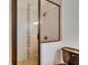 Walk-in shower with mosaic tile detailing, a glass door, and modern bronze fixtures at 2920 N 11Th St, Tampa, FL 33605